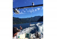 photo behind 1993 Seaswirl 185SE while wakeboarding
