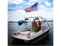 2004 Stingray 190LS wakeboard tower with American flag